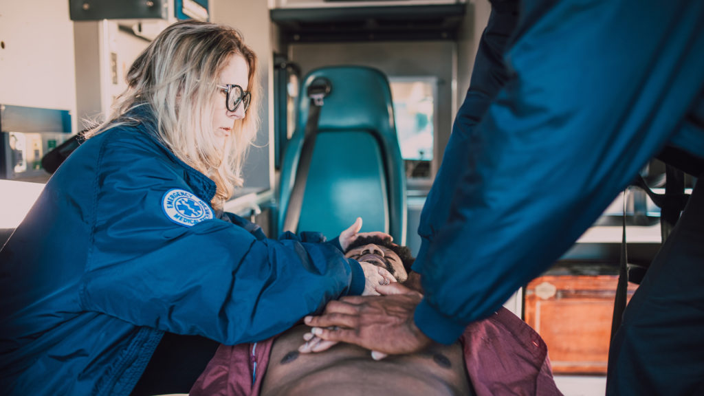 paramedics caring for an injured driver