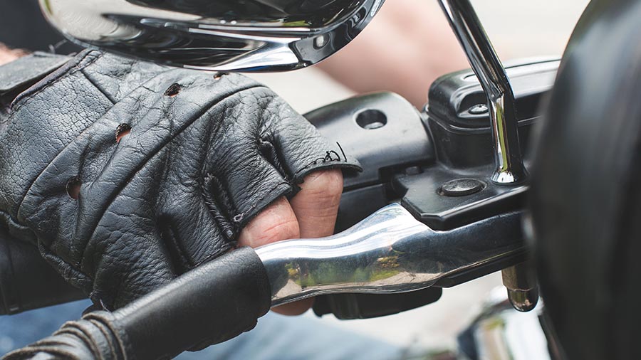 hands on a motorcycle handle